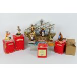 Royal Doulton - HMS Bunnykins display stand and seven figures to include Captain, Pirate, Cook,