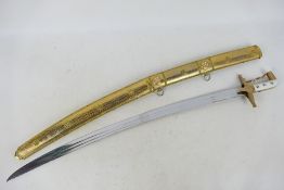 A scimitar type sword with 78 cm (l) blade and 89 cm (l) overall,