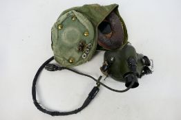 An RAF G Type green canvas flying helmet with earphones.