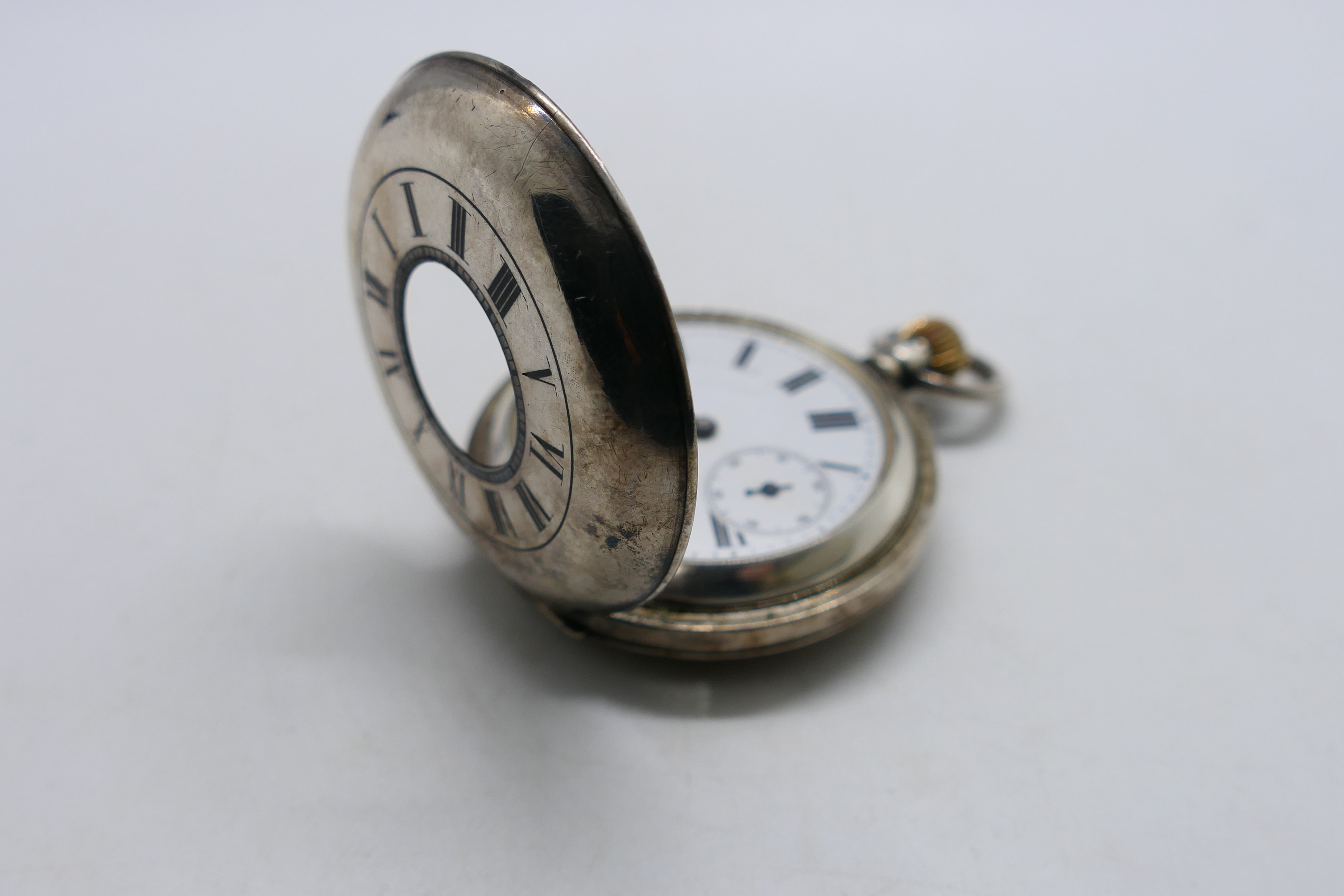 A Victorian silver half hunter pocket watch with Roman numerals to a white enamel dial, - Image 7 of 8