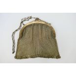 A hallmarked silver mesh purse, London import marks 1916, sponsors mark for Heasman & Co,