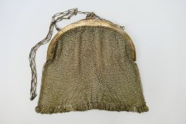 A hallmarked silver mesh purse, London import marks 1916, sponsors mark for Heasman & Co,