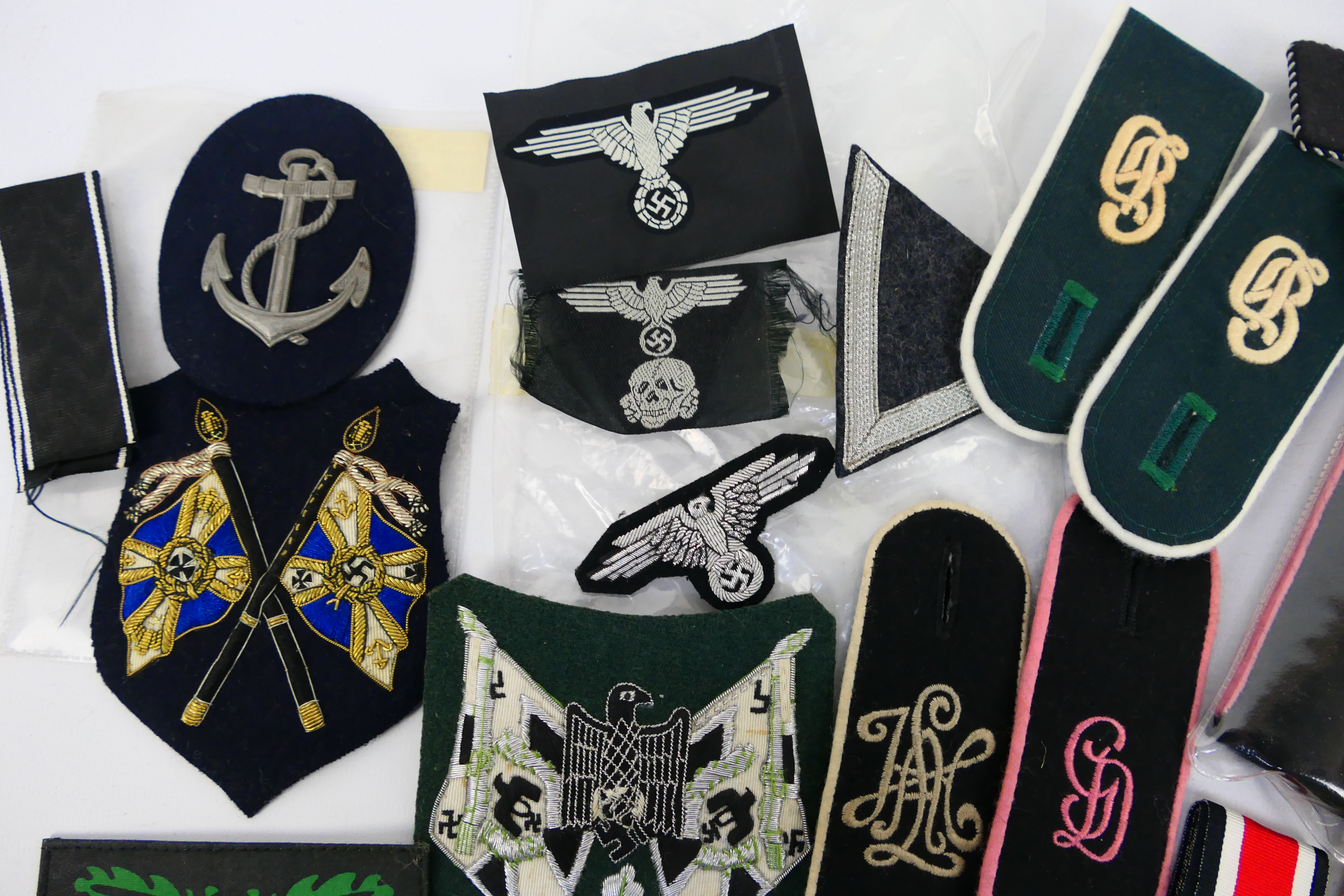 A collection of World War Two (WW2 / WWII) style German insignia to include collar tabs, - Image 3 of 7