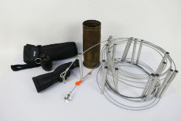 Lot to include a monocular scope, cable ladder, shell casing and replica grenade.