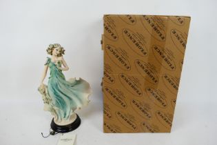 A boxed Florence Giuseppe Armani figure entitled Enchanting Spring, approximately 35 cm (h).