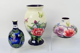Three pieces of Old Tupton Ware, two pieces decorated with flowers and butterflies,