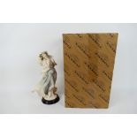 A boxed Florence Giuseppe Armani figure entitled Winter Reverie, approximately 34 cm (h).