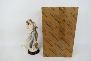 A boxed Florence Giuseppe Armani figure entitled Winter Reverie, approximately 34 cm (h).