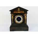 A late 19th/ early 20th century French black marble mantel clock,