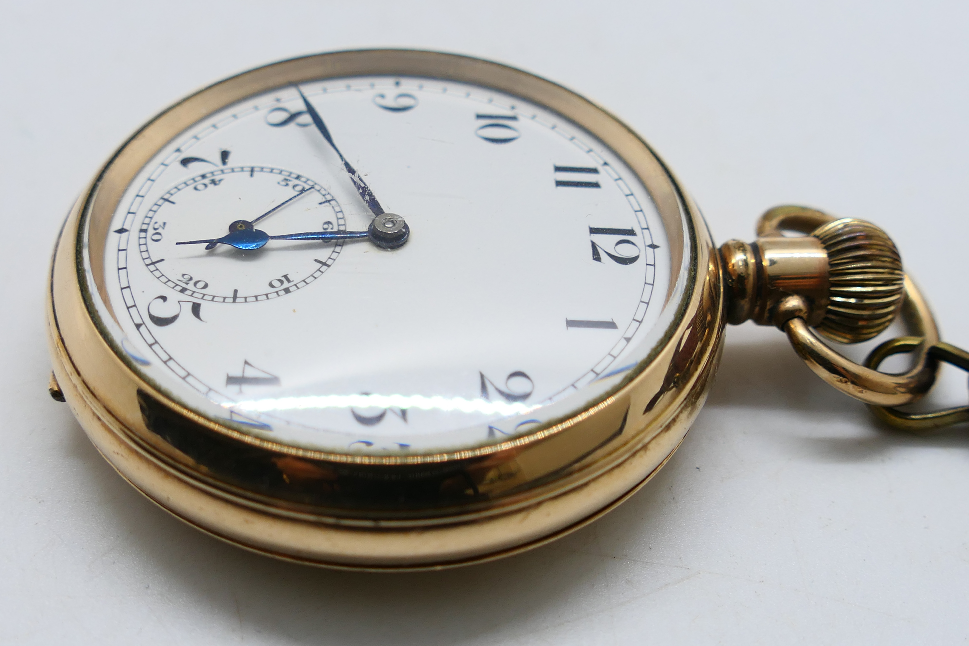 A gold plated open face pocket watch, Arabic numerals to a white enamel dial, - Image 3 of 8