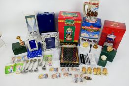 A quantity of boxed items of gift ware to include photograph frames, Budweiser steins,