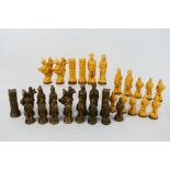 A set of viking themed chess pieces having 12.5 cm (h) king.
