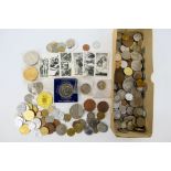 A collection of UK and foreign coins and commemoratives, a small quantity with silver content noted.