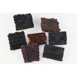 A collection of vintage, carved wooden printing blocks.