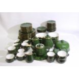 A quantity of Apilco, France table wares, green with gilt borders, approximately 70 pieces. [2].