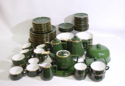 A quantity of Apilco, France table wares, green with gilt borders, approximately 70 pieces. [2].