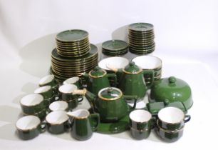 A quantity of Apilco, France table wares, green with gilt borders, approximately 70 pieces. [2].