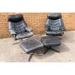 Two black leather chairs with matching footstools. [4].