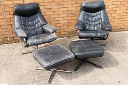 Two black leather chairs with matching footstools. [4].