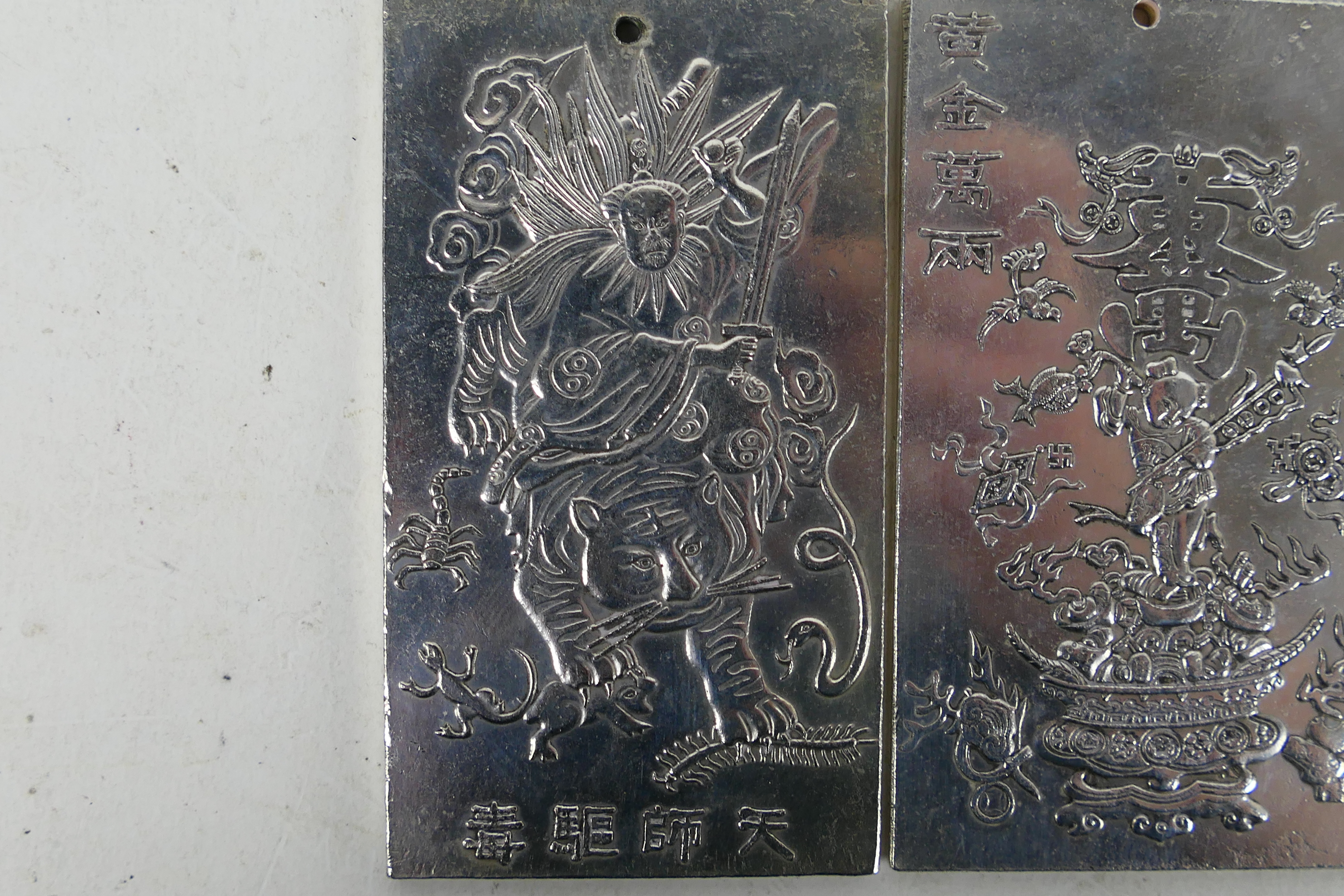 Two Chinese white metal plaques / trade tokens one decorated with a warrior riding a tiger, - Image 2 of 6