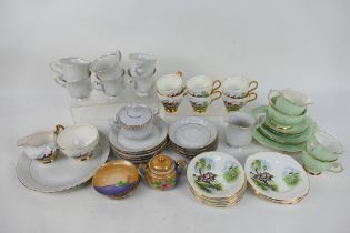 A collection of mixed tea wares to include Royal Imperial Bone China decorated with fox hunting