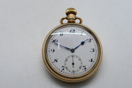 A gold plated open face pocket watch, Arabic numerals to a white enamel dial,