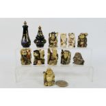 A group of Asian style figures and similar, largest approximately 5.5 cm (h).