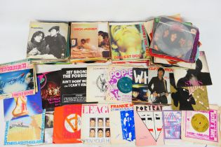 A collection of 7" vinyl records to include Motown, David Bowie, Human League, Soft Cell,