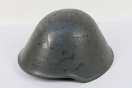 An East German M56 / 76 steel combat helmet with liner.