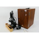 A Vickers Instruments M70 binocular microscope contained in fitted case with accessories.