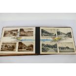 Deltiology - A vintage Japanese postcard album with inlaid black lacquer covers housing postcards