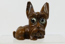A German composite novelty clock in the form of a dog with rolling eyes to indicate the time (A/F