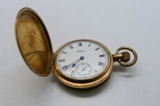A gold plated full hunter Waltham pocket watch, Roman numerals to a white enamel dial,