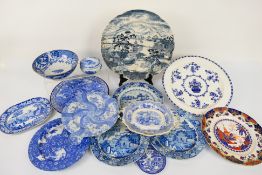 A group of predominantly 19th Century blue and white pottery comprising a Sicilian pattern twin