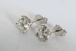 A pair of 18ct white gold Diamond stud earrings,