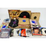 A collection of 7" vinyl records to include The Beatles, Michael Jackson, Fleetwood Mac, Nena,