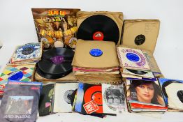 A collection of 7" vinyl records to include The Beatles, Michael Jackson, Fleetwood Mac, Nena,