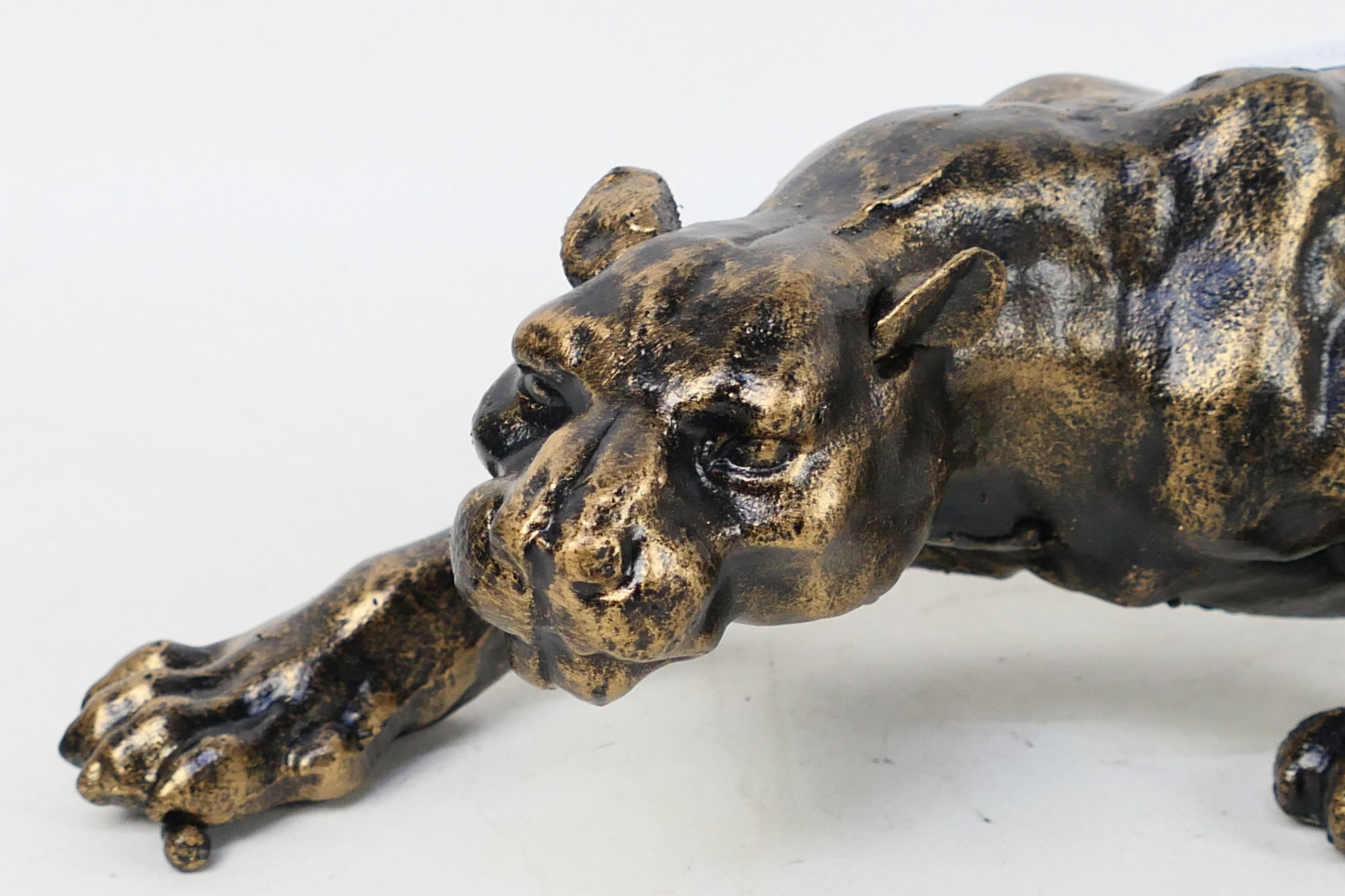 A bronzed cast iron model depicting a panther, approximately 40 cm (l). - Image 2 of 3