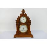 A vintage clock / barometer in wooden case, the case believed to be carved from a yew church pew,