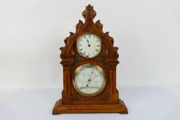 A vintage clock / barometer in wooden case, the case believed to be carved from a yew church pew,