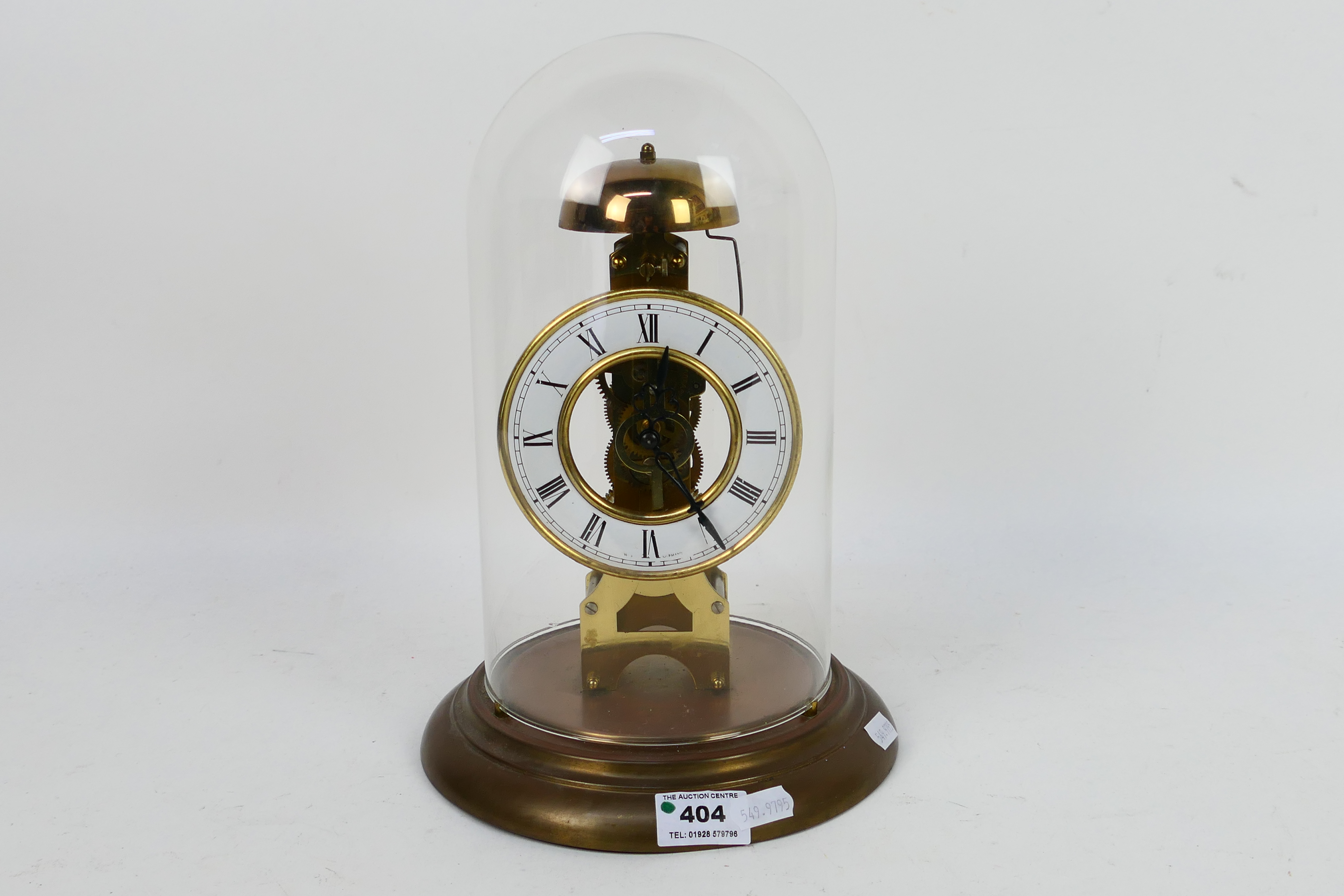 A President skeleton clock with Roman numeral chapter ring, housed under glass dome, 29 cm (h).