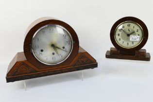 A Napoleon Hat oak cased mantel clock, Haller movement, Arabic numerals on a silvered dial,