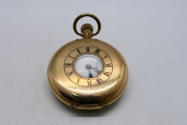 A gold plated half hunter pocket watch, Roman numerals to a white enamel dial,