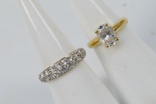 Two 14ct yellow gold rings set with white stones, size H+½, approximately 2.9 grams.