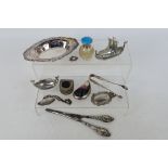 A mixed group of small items to include hallmarked silver dish, silver handled glove stretchers,