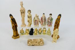 A collection of Asian figures to include Fu, Lu and Shou, Budai and similar,