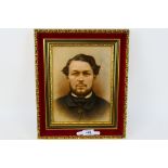 A framed oil on board portrait depicting a bearded gentleman,