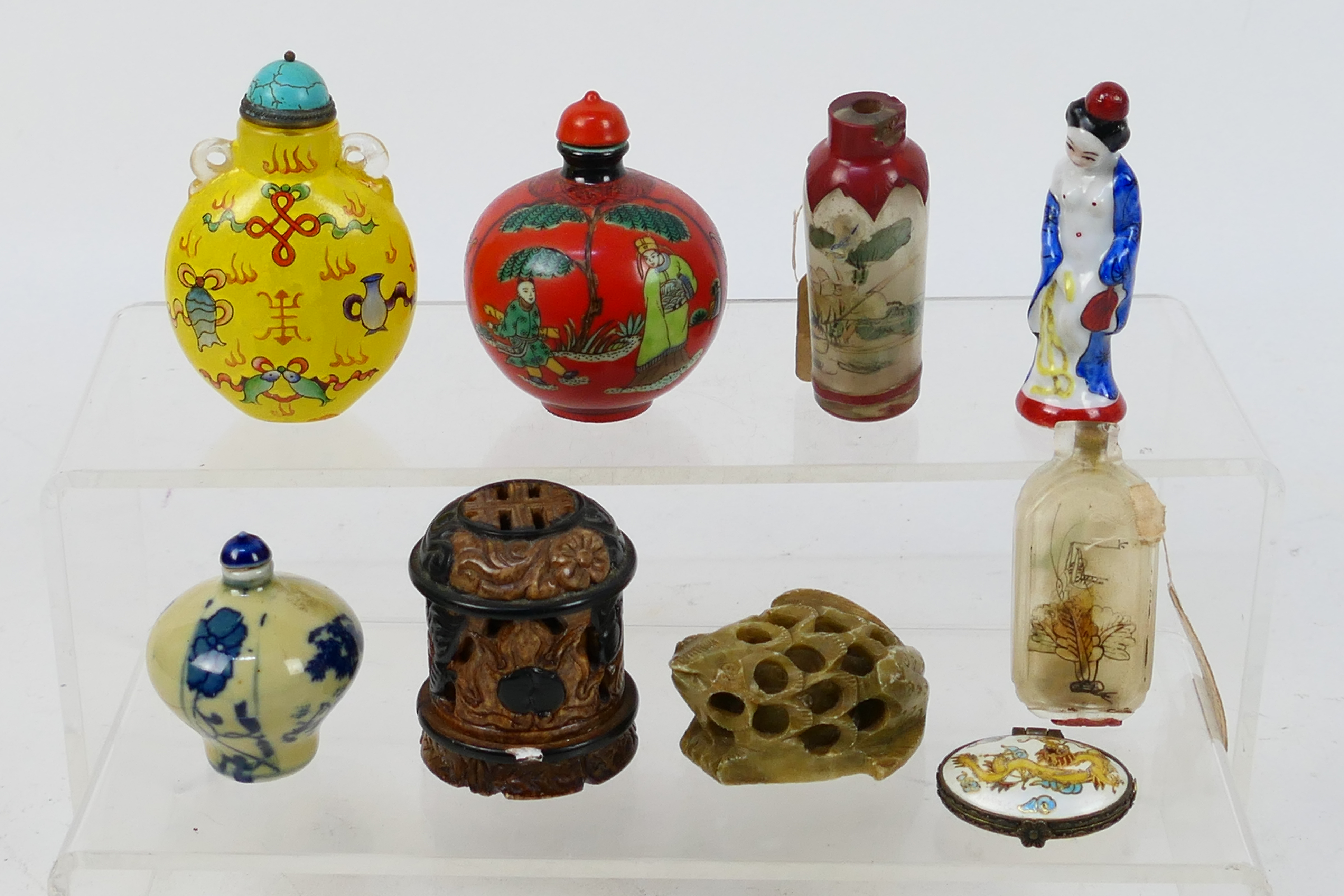 Lot to include snuff bottles, glass and ceramic examples, carved stone items and other.