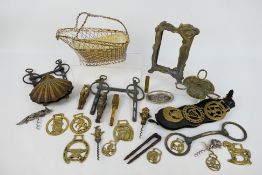 Metal / brass ware to include horse brasses, bottle openers, nutcrackers and other.