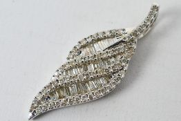 A 9ct white gold Diamond set leaf / swirl style pendant containing round brilliant cut diamonds and